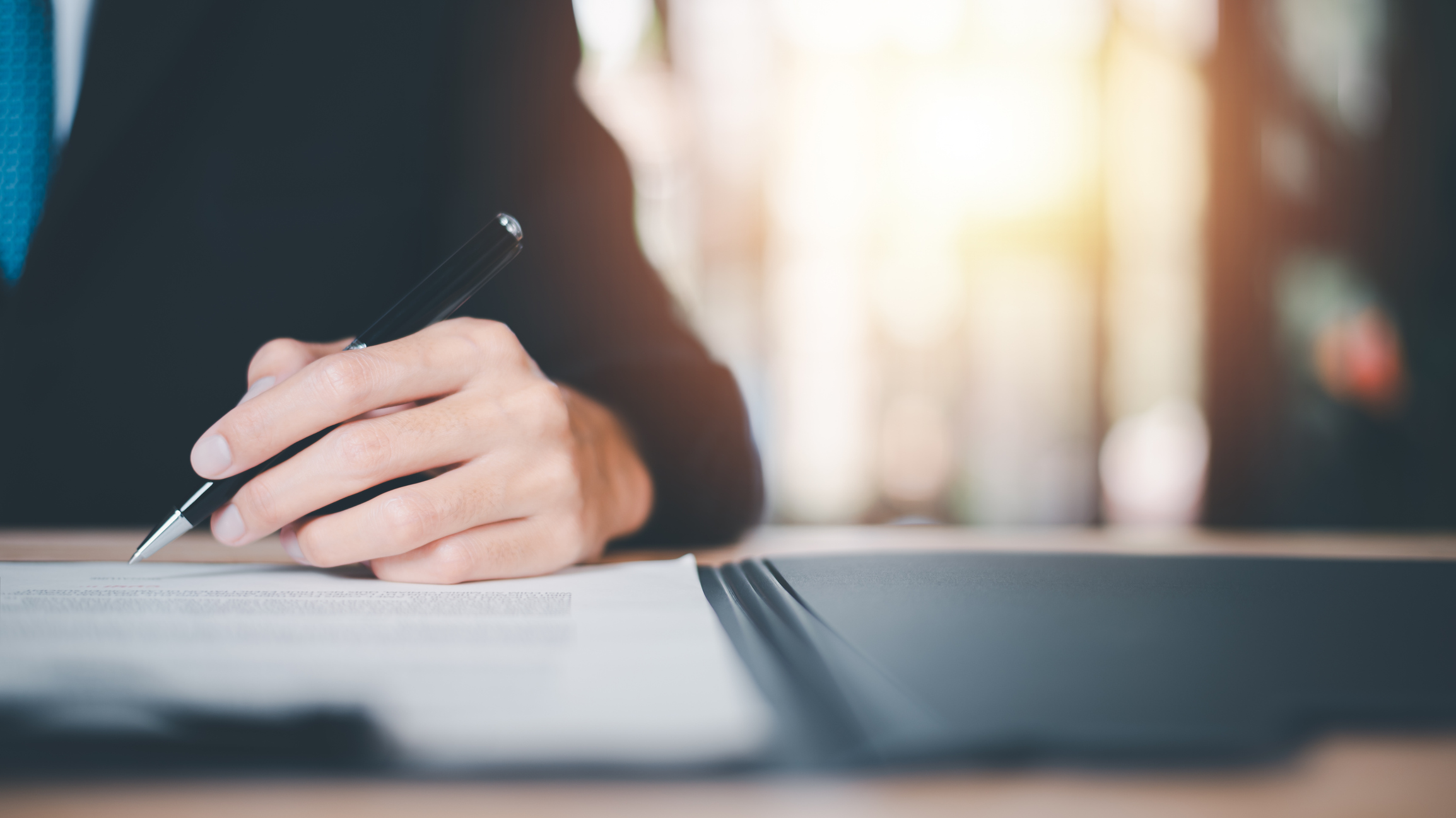 Business person reviews contractual agreement
