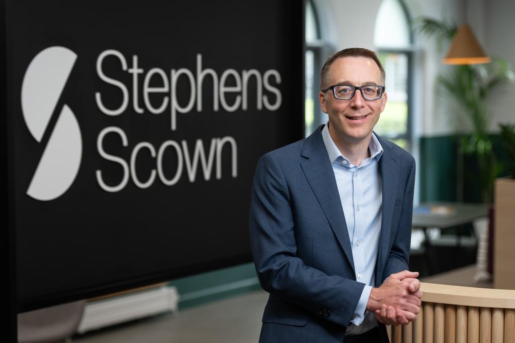 Photograph of Chris Twaits standing in the Stephens Scown client lounge