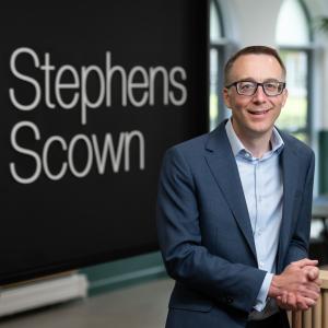 Photograph of Chris Twaits standing in the Stephens Scown client lounge