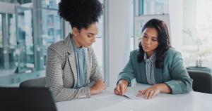 Business woman having explained an NDA and signing it