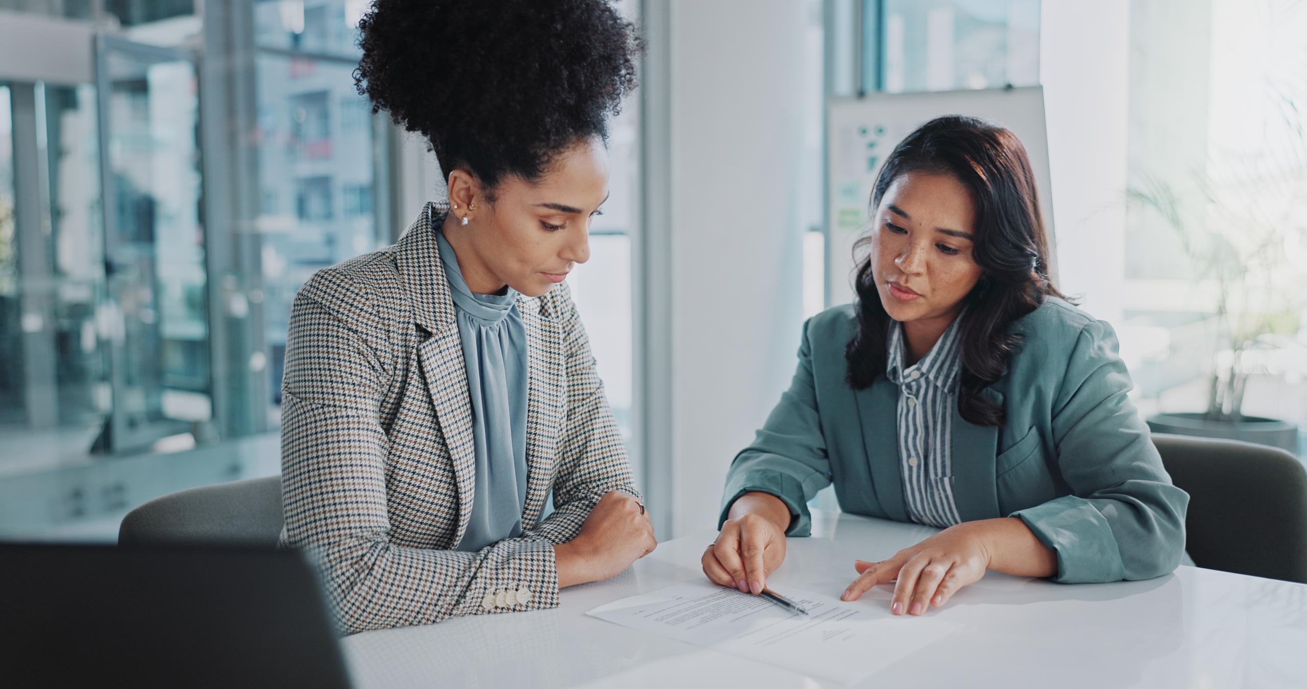 Business woman having explained an NDA and signing it