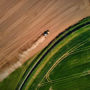 Tractor farming field drone shot for a farming businesses