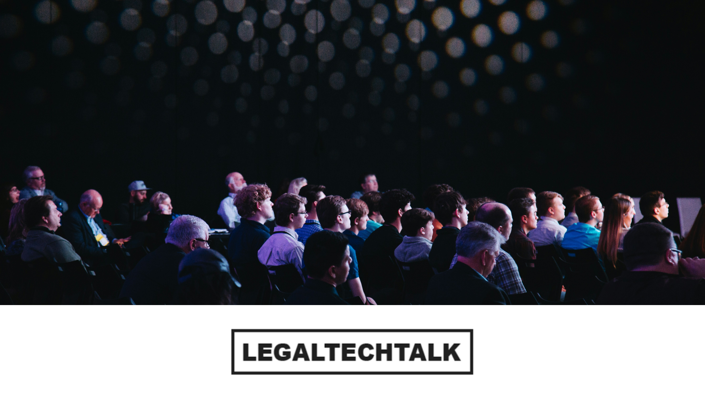 Conference with delegates looking intently at speaker